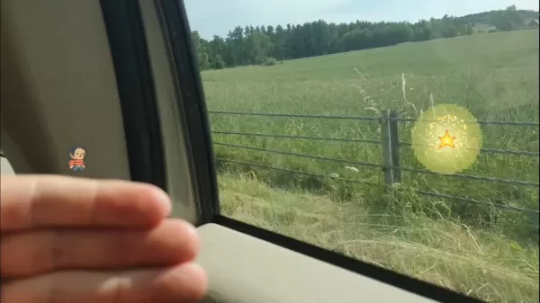 A man is holding out his hand, with a small pixel character stood atop it. In the background we can see he